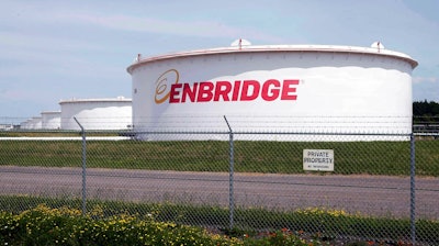 This June 29, 2018 photo shows tanks at the Enbridge Energy terminal in Superior, Wis. Enbridge Energy's plan to replace its aging Line 3 crude oil pipeline across northern Minnesota has hit another obstacle. Earlier this month a court said the project's environmental impact statement failed to address the possibility of an oil spill into the Lake Superior watershed. Now the Minnesota Pollution Control Agency and Department of Natural Resources say they can't take final action on the project's permits until the Public Utilities Commission addresses the deficiencies.