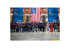 New employees at GE Appliances’ new smart warehouse in Commerce, Georgia – representing some of the 100 new jobs created for the facility – prepare to cut the ribbon and celebrate the opening of the location.
