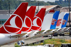 The tails of several of the dozens of grounded Boeing 737 MAX airplanes line the edge of a parking area adjacent to Boeing Field Thursday, June 27, 2019, in Seattle. A new software problem has been found in the troubled Boeing 737 Max that could push the plane's nose down automatically, and fixing the flaw is almost certain to further delay the plane's return to flying after two deadly crashes. Boeing said Wednesday, June 26, 2019, that the FAA 'identified an additional requirement' for software changes that the aircraft manufacturer has been working on for eight months, since shortly after the first crash.