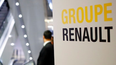 A sign of French automaker Renault Group shows the way for the Renault shareholders general meeting in Paris, France, Wednesday, June 12, 2019.