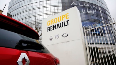 This photo taken on Thursday, Jan. 24, 2019 show a Ranult car parking outside the French carmaker headquarters in Boulogne-Billancourt, outside Paris, France. French carmaker Renault looks set to give its approval to Fiat Chrysler's merger offer. The company's board is meeting Tuesday afternoon at its headquarters to decide on a deal that could reshape the global auto industry.