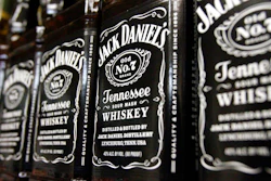 In this Dec. 5, 2011, file photo, bottles of Jack Daniel's Tennessee Whiskey line the shelves of a liquor outlet in Montpelier, Vt. The company that makes Jack Daniels took a hit from the Trump administration’s tariff fight, estimating that the standoff dragged sales growth down by a percentage point for the entire year. Brown-Forman Corp. (BF.A) on Wednesday, June 5, 2019, reported fiscal fourth-quarter net income of $159 million.