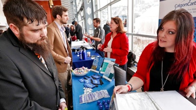 In this March 7, 2019, file photo visitors to the Pittsburgh veterans job fair meet with recruiters at Heinz Field in Pittsburgh. On Wednesday, June 5, payroll processor ADP reports how many jobs private employers added in May.