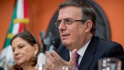 Mexican Foreign Affairs Secretary Marcelo Ebrard, right, accompanied by Mexican Ambassador Martha Barcena Coqui, speaks during a news conference at the Mexican Embassy in Washington, Monday, June 3, 2019, as part of a Mexican delegation in Washington for talks following trade tariff threats from the Trump Administration.