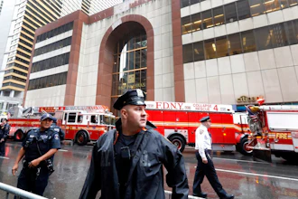 New York City Police and Fire Department personnel secure the scene in front of a building in midtown Manhattan where a helicopter crash landed, Monday, June 10, 2019. The Fire Department says the helicopter crash-landed on the top of the tower, which isn't far from Rockefeller Center and Times Square.