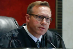 Judge Thad Balkman announces that he has signed off on the state's $85 million settlement with Israeli-owned Teva Pharmaceuticals on Monday, June 2, 2019, following a squabble between the attorney general, Legislature and governor over how the deal was structured during the Opioid trial in Norman, Okla.