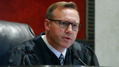 Judge Thad Balkman announces that he has signed off on the state's $85 million settlement with Israeli-owned Teva Pharmaceuticals on Monday, June 2, 2019, following a squabble between the attorney general, Legislature and governor over how the deal was structured during the Opioid trial in Norman, Okla.