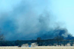 In this Monday, Jan. 22, 2018, file photo, smoke billows from the site of a gas well fire near Quinton, Okla. A federal report says the explosion and fire that killed five workers at the southeastern Oklahoma natural gas well in 2018 was caused by the failure of blowout prevention devices and other factors.