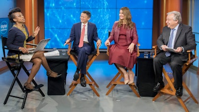 Moderator Femi Oke, left, Jack Ma, second left, Melinda Gates, and United Nations Secretary-General Antonio Guterres, participate in a live conversation on digital cooperation.