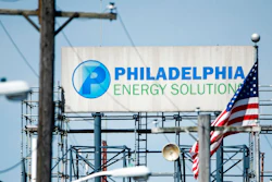 A sign for Philadelphia Energy Solutions stands at the refining complex in Philadelphia, Thursday, June 27, 2019. The largest oil refinery on the East Coast said Wednesday that it will close after a devastating fire last week that set off explosions and damaged equipment.