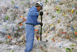 In this June 18, 2019, photo, a plastic recycling company worker sorts out plastic bottles collected for processing at Tokyo Petbottle Recycle Co., Ltd, in Tokyo. Japan has a plastic problem. Single bananas here are sometimes wrapped in plastic. So are individual pieces of vegetables, fruit, pastries, pens and cosmetics. Plastic-wrapped plastic spoons come with every ice cream cup. But as world leaders descend on Osaka for the two-day G20 Summit that starts Friday, June 28, Japan has ambitions to become a world leader in reducing plastic waste.