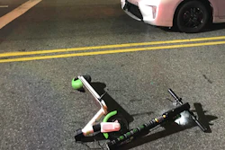 In this Dec. 23, 2018, a scooter Andrew Hardy was riding sits near the car that hit him while riding the scooter in Los Angeles.