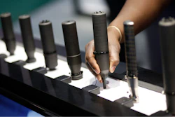 In this file photo, gun silencers are on display at the Sig Sauer booth at the Shooting, Hunting and Outdoor Trade Show in Las Vegas.