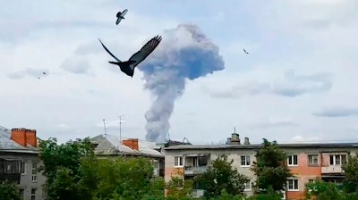 A smoke cloud rises after an explosion in a plant manufacturing TNT in Dzerzhinsk, 400 kilometers (250 miles) east of Moscow, Russia, Saturday, June 1, 2019. An investigation is underway but the cause of the blast has not been determined and Russia's health ministry says 79 people have been injured in an explosion in a plant manufacturing TNT.