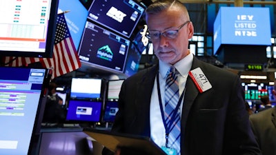 Trader Neil Catania works on the floor of the New York Stock Exchange, Tuesday, June 18, 2019. Stocks are opening higher on Wall Street following big gains in Europe after the head of the European Central Bank said it was ready to cut interest rates and provide more economic stimulus if necessary.