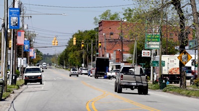 This photo taken Wednesday, April 17, 2019 shows Jones Street, the main thoroughfare through Trenton, N.C. Eight months after the hurricane inundated North Carolina, communities such as Trenton illustrate the slow and uneven pace of recovery.