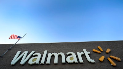 This Nov. 9, 2018, file photo shows a Walmart Supercenter in Houston. Walmart agreed Thursday, June 20, 2019, to pay $282 million to settle civil and criminal allegations of overseas corruption, including payment through a Brazilian subsidiary of more than $500,000 to an intermediary known as a 'sorceress' for her uncanny ability to make permit problems disappear.