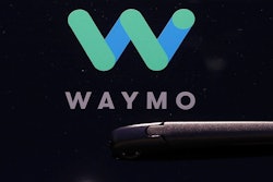 This Tuesday, May 8, 2018, file photo shows a Waymo logo displayed on the window of a car at the Google I/O conference in Mountain View, Calif. Self-driving car pioneer Waymo is teaming up with automakers Renault and Nissan to make its first journey outside the U.S. with a ride-hailing service that will dispatch a fleet of robotaxis in France and Japan.
