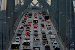 In this Dec. 10, 2015, file photo, vehicles make their way westbound on Interstate 80 across the San Francisco-Oakland Bay Bridge as seen from Treasure Island in San Francisco. Major automakers are urging the Trump administration and California to go back to the negotiating table over vehicle mileage standards to prevent a legal battle. The companies sent letters Thursday, June 6, 2019, to President Donald Trump and California Gov. Gavin Newsom saying a failure to reach agreement would create instability in the auto market.
