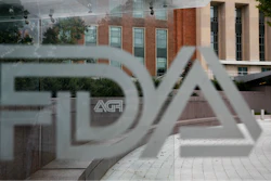 This Thursday, Aug. 2, 2018, file photo shows the U.S. Food and Drug Administration building behind FDA logos at a bus stop on the agency's campus in Silver Spring, Md. The Food and Drug Administration’s first broad testing of food for a worrisome class of nonstick, stain-resistant industrial compounds found high levels in some grocery store meats and seafood and in off-the-shelf chocolate cake, according to unreleased findings FDA researchers presented at a scientific conference in Europe.