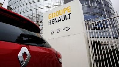 This photo taken on Thursday, Jan. 24, 2019 show a Ranult car parking outside the French carmaker headquarters in Boulogne-Billancourt, outside Paris, France. French carmaker Renault looks set to give its approval to Fiat Chrysler's merger offer. The company's board is meeting Tuesday afternoon at its headquarters to decide on a deal that could reshape the global auto industry.