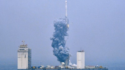 In this photo released by Xinhua News Agency, a Long March-11 solid propellant carrier rocket blasts off from a mobile launch platform in the Yellow Sea off east China's Shandong Province, Wednesday, June 5, 2019. China has for the first time launched a rocket from a mobile platform in the Yellow Sea, sending a five commercial satellites and two others containing experimental technology into space.