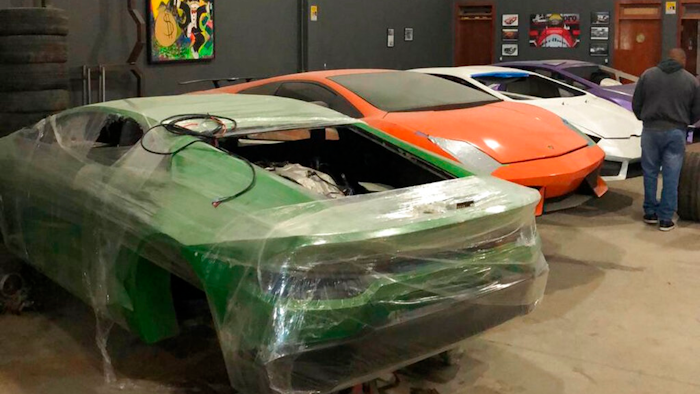 This July 15, 2019 photo released by Itajai Civil Police, shows car molds of luxury car replicas at a workshop in Itajai, Brazil. Brazilian police dismantled a clandestine workshop run by a father and son who assembled fake Ferraris and Lamborghinis to order, in Brazil's southern state of Santa Catarina.