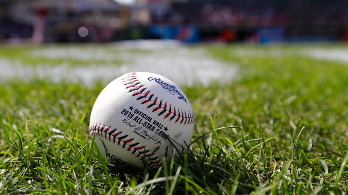 A baseball is pictured as the American League warms-up for the MLB baseball All-Star Game, Tuesday, July 9, 2019, in Cleveland. Faced with a record onslaught of home runs and pitchers convinced baseballs are juiced, Commissioner Rob Manfred says the sport has been unable to find any changes in the manufacturing process.