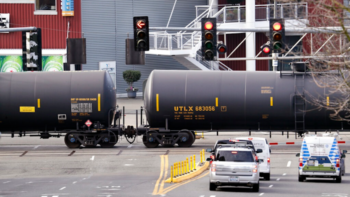 - In this Feb. 13, 2018, file photo, automobile traffic waits at a train crossing as train cars that carry oil are pulled through downtown Seattle. Attorneys general for North Dakota and Montana have petitioned the Trump administration Wednesday, July 17, 2019, to overrule a Washington state law that imposes safety restrictions on oil shipped by rail from the Northern Plains.