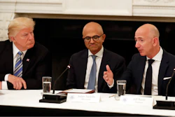 In this file photo, Donald Trump, left, and Satya Nadella, Chief Executive Officer of Microsoft, center, listen as Jeff Bezos, Chief Executive Officer of Amazon, speaks during an American Technology Council roundtable in the State Dinning Room of the White House in Washington.