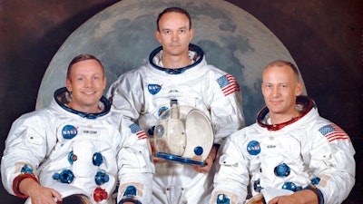 This March 30, 1969 photo made available by NASA shows the crew of the Apollo 11, from left, Neil Armstrong, commander; Michael Collins, module pilot; Edwin E. 'Buzz' Aldrin, lunar module pilot. Apollo 11 was the first manned mission to the surface of the moon.