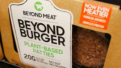 In this June 27, 2019, file photo a meatless burger patty called Beyond Burger made by Beyond Meat is displayed at a grocery store in Richmond, Va. Beyond Meat reports financial earns Monday, July 29.
