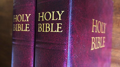 In this July 5, 2019 Bibles are displayed in Miami. Religious publishers say President Trump's most recently proposed tariffs on Chinese imports could result in a Bible shortage. That's because millions of Bibles, some estimates put it at 150 million or more, are now printed in China each year. Critics of a proposed tariff say it would not only make the Bible more expensive for consumers, it would also hurt the evangelical efforts of Christian organizations that give away Bibles as part of their ministry.