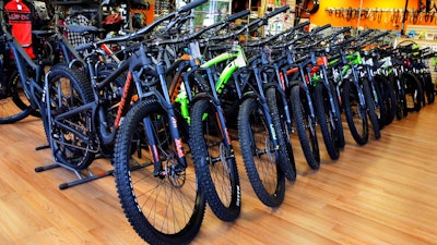 In this July 10, 2019, photo, mountain bikes are displayed at Cycles Etc bicycle shop in Salem, N.H. On Tuesday, July 16, the Commerce Department releases U.S. retail sales data for June.