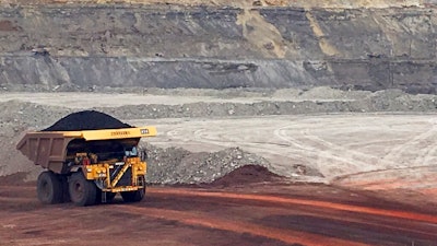 In this March 28, 2017, file photo, a dump truck hauls coal at Contura Energy's Eagle Butte Mine near Gillette, Wyo.Two coal mines in Wyoming and one in West Virginia owned by a company in bankruptcy could reopen if a judge approves a purchase offer. Court documents show Bristol, Tennessee-based Contura Energy has offered $20.6 million for the mines owned by Milton, West Viginia-based Blackjewel LLC. The mines have been closed since Blackjewel filed for bankruptcy July 1, 2019.