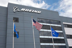 In this May 14, 2019, file photo flags fly outside the main building of The Boeing Company's Oklahoma City facility in Oklahoma City. Boeing Co. reports earning on Wednesday, July 24, 2019.