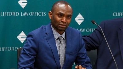 In this April 29, 2019, file photo, Paul Njoroge, who lost his wife and three young children in the March 10 crash of an Ethiopian Airlines' Boeing 737 Max 8 aircraft, speaks at a news conference in Chicago. Njoroge believes Boeing should scrap the 737 Max, and he wants the company’s top executives to resign and face criminal charges for not grounding the plane after a deadly accident last October. On Wednesday, July 17, Njoroge will be the first relative of any of the 346 passengers who died in those crashes to testify before Congress.