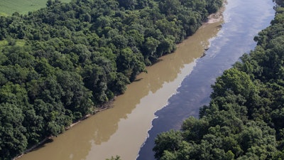 Bourbon mixes with water in the Kentucky River following a fire at a Jim Beam distillery in Woodford County, Kentucky.