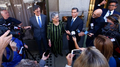 In this Sept. 24, 2018, file photo, from left, Cal/EPA Secretary Matthew Rodriguez, California Air Resources Board Chair Mary Nichols and California Attorney General Xavier Becerra talk to the media in Fresno, Calif. Nichols says she’s not optimistic about striking a compromise with the Trump administration over its efforts to relax mileage standards, resolving a bitter standoff threatening to unleash years of court fights and confusion in the U.S. auto industry.