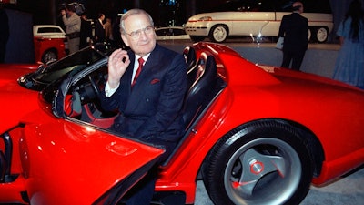 In this March 28, 1990, file photo, Chrysler Corporation Chairman Lee Iacocca sits in a 1990 Dodge Viper sports car as the Chrysler in the 90's six city tour makes a visit to New York. Former Chrysler CEO Iacocca, who became a folk hero for rescuing the company in the '80s, has died, former colleagues said Tuesday, July 2, 2019. He was 94.
