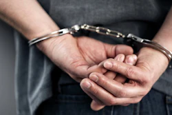 Closeup Of Cuffed Criminal Hands 000059885946 Small