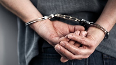 Closeup Of Cuffed Criminal Hands 000059885946 Small