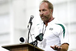 In this Sept. 6, 2014 photo, Chris Cline speaks as Marshall University dedicates the new indoor practice facility as the Chris Cline Athletic Complex in Huntington, W.Va. Police in the Bahamas say a helicopter flying from Big Grand Cay island to Fort Lauderdale has crashed, killing seven Americans on board. None of the bodies recovered from the downed helicopter have been identified, but police Supt. Shanta Knowles told The Associated Press on Friday, July 5, 2019, that the missing-aircraft report from Florida said billionaire Chris Cline was on board.