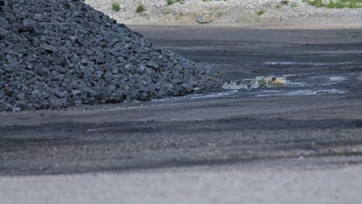 Coal Pile With Dirty Puddle 499534645 4272x2077 (1)