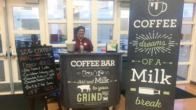 This Feb. 22, 208 photo provided by Orange County Public Schools shows a coffee stand at Cypres Creek High School in Orlando, Fla. Orange County schools did not receive dairy industry grants for the coffee bars, but the local dairy council provided chalkboard-style signs and menus.