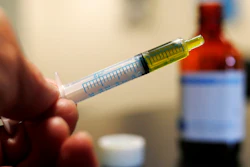 In this Nov. 6, 2017 file photo, a syringe with a dose of CBD oil is shown in a research laboratory in Fort Collins, Colo. CBD is a compound found in marijuana but doesn’t cause a high. On Tuesday, July 23, 2019, the Food and Drug Administration announced it has warned Curaleaf Inc., of Wakefield, Mass., for illegally selling unapproved CBD products. The agency says Curaleaf’s claims could lead people to delay medical care for serious conditions like cancer.