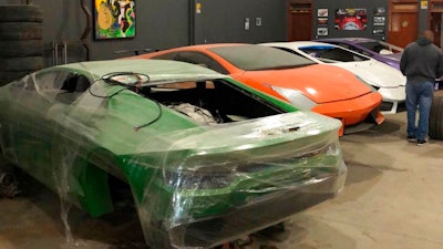 This July 15, 2019 photo released by Itajai Civil Police, shows car molds of luxury car replicas at a workshop in Itajai, Brazil. Brazilian police dismantled a clandestine workshop run by a father and son who assembled fake Ferraris and Lamborghinis to order, in Brazil's southern state of Santa Catarina.