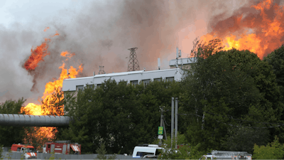 Black smoke and flames rise over a power station, in Mytishchi, outside Moscow, Russia.