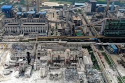 An aerial view shows the aftermath of the blast at a gas plant in Yima city in central China's Henan province Saturday, July 20, 2019. The Friday evening explosion shattered windows 3 kilometers (1.9 miles) away, and knocked off doors inside buildings, killing some and injuring others.