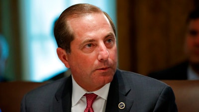 In this Tuesday, July 16, 2019, file photo, Health and Human Services Secretary Alex Azar pauses while speaking during a Cabinet meeting at the White House, in Washington. Azar says he and President Donald Trump are working on a plan to allow Americans to import lower-priced prescription drugs from Canada.